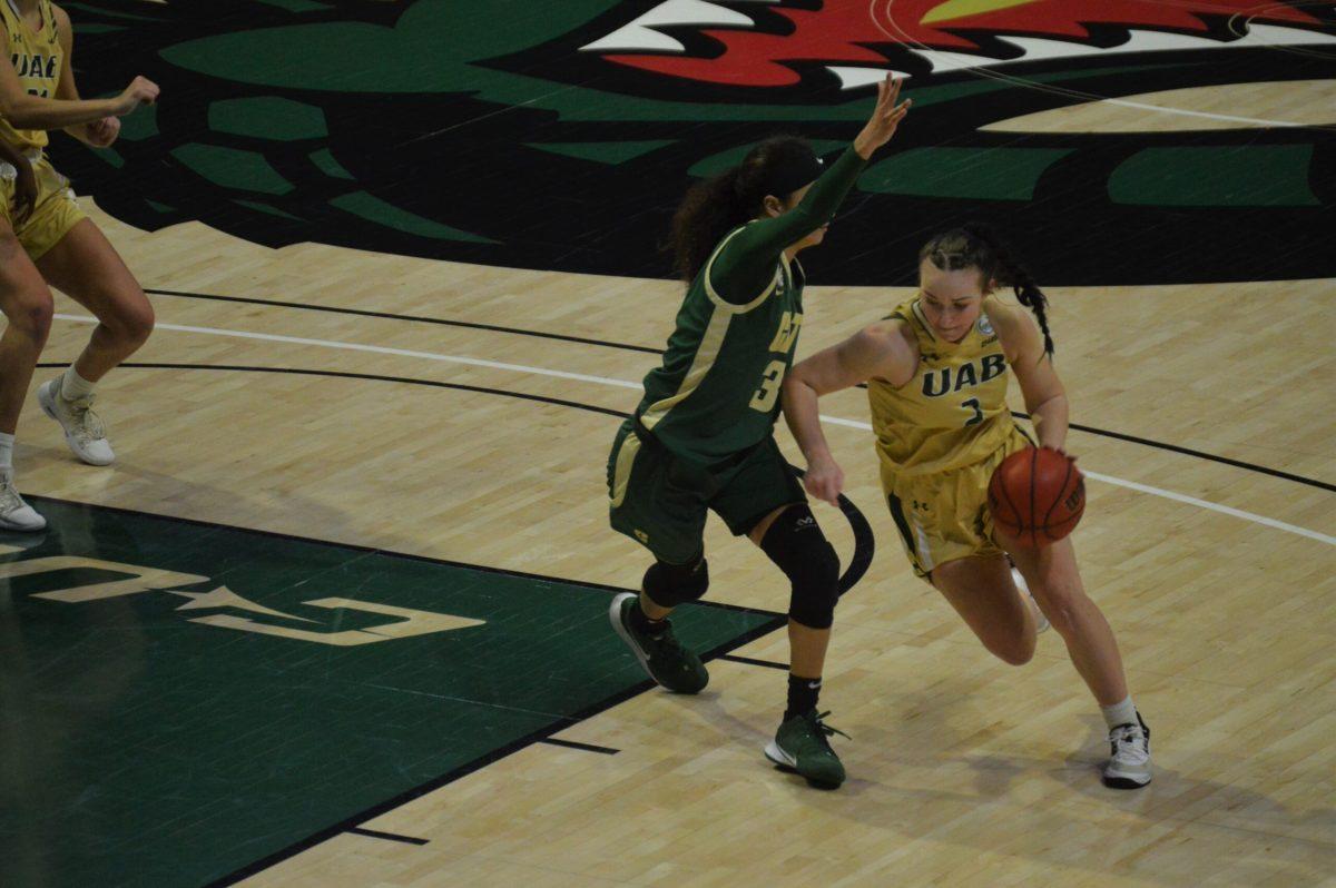 Sam Mitchell drives against Charlotte