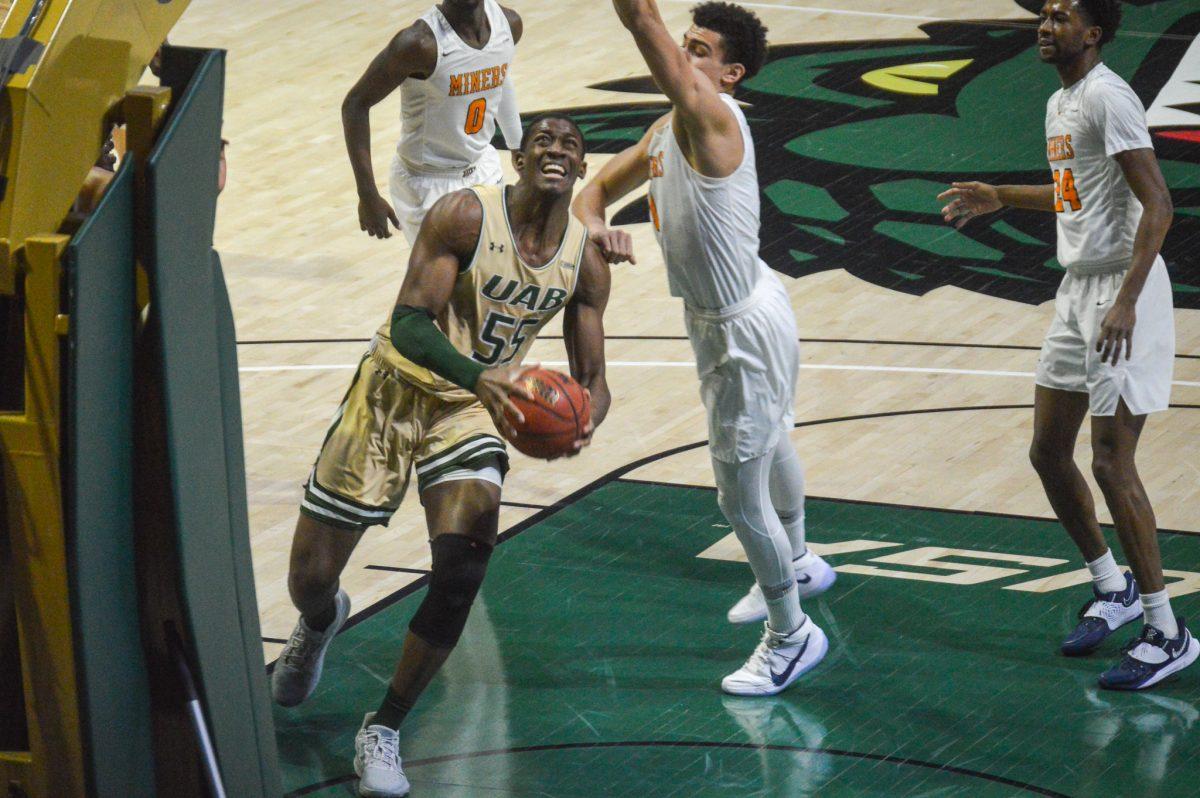 Center Trey Jemison drives against the UTEP Miners | Caleb Wood