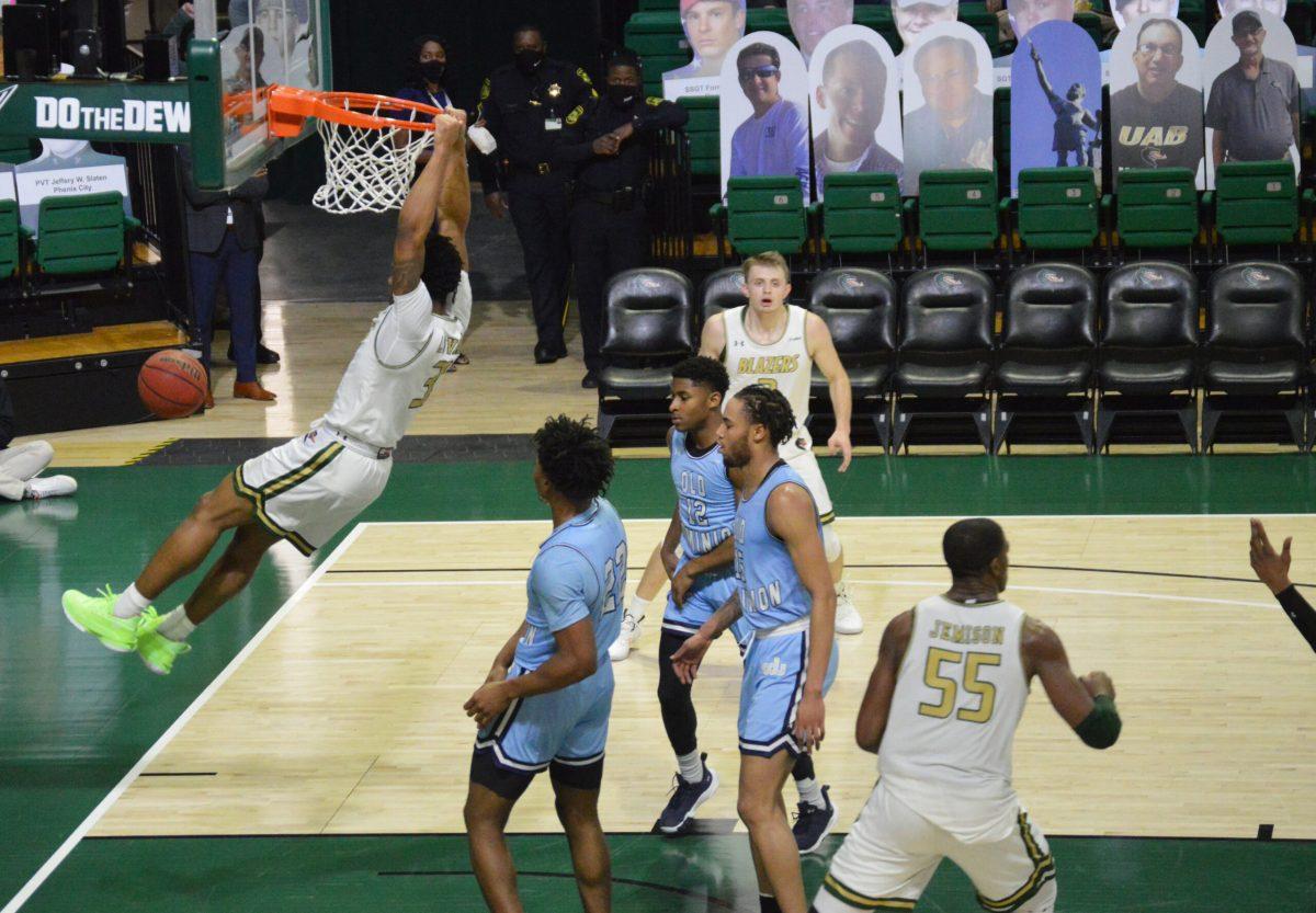 Tavin Lovan dunks against Old Dominion | Photo by Caleb Wood