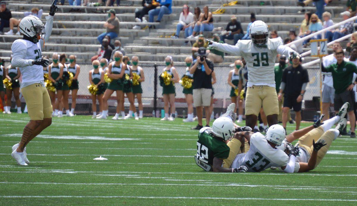 The UAB secondary celebrates an interception | Photo by Caleb Wood