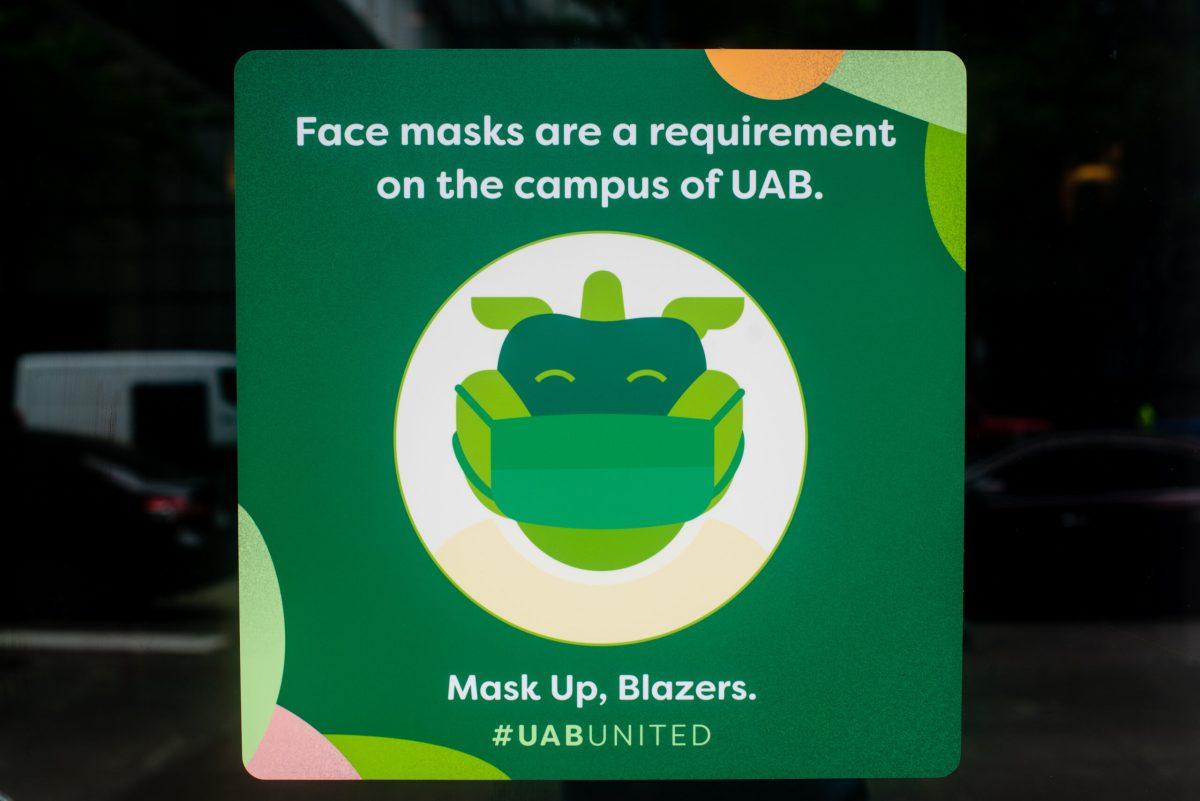 Close-up of social distancing sign that reads "Face masks are a requirement on the campus of UAB. Mask Up, Blazers. #UAB UNITED" in the Faculty Office Tower building during the COVID-19 (Coronavirus Disease) pandemic, 2020.