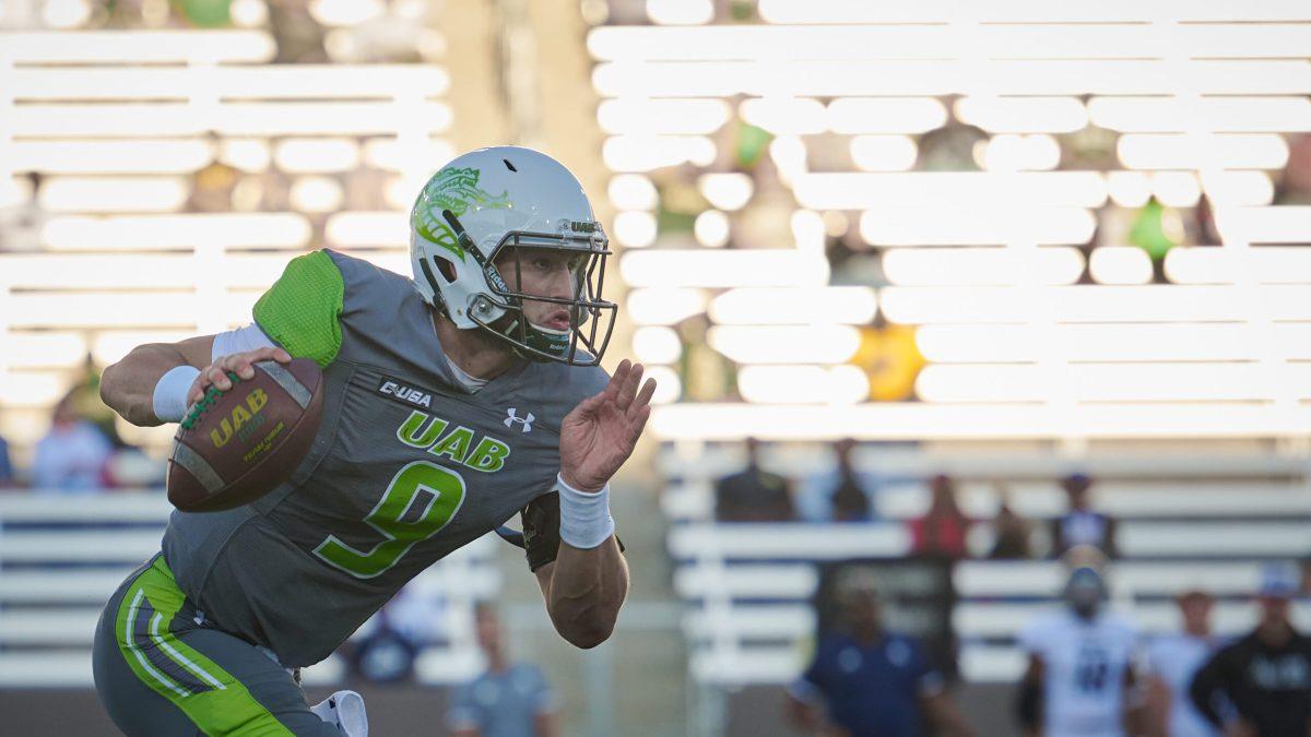 Quarterback Dylan Hopkins rushes against Rice | Photo by Dawson Martin