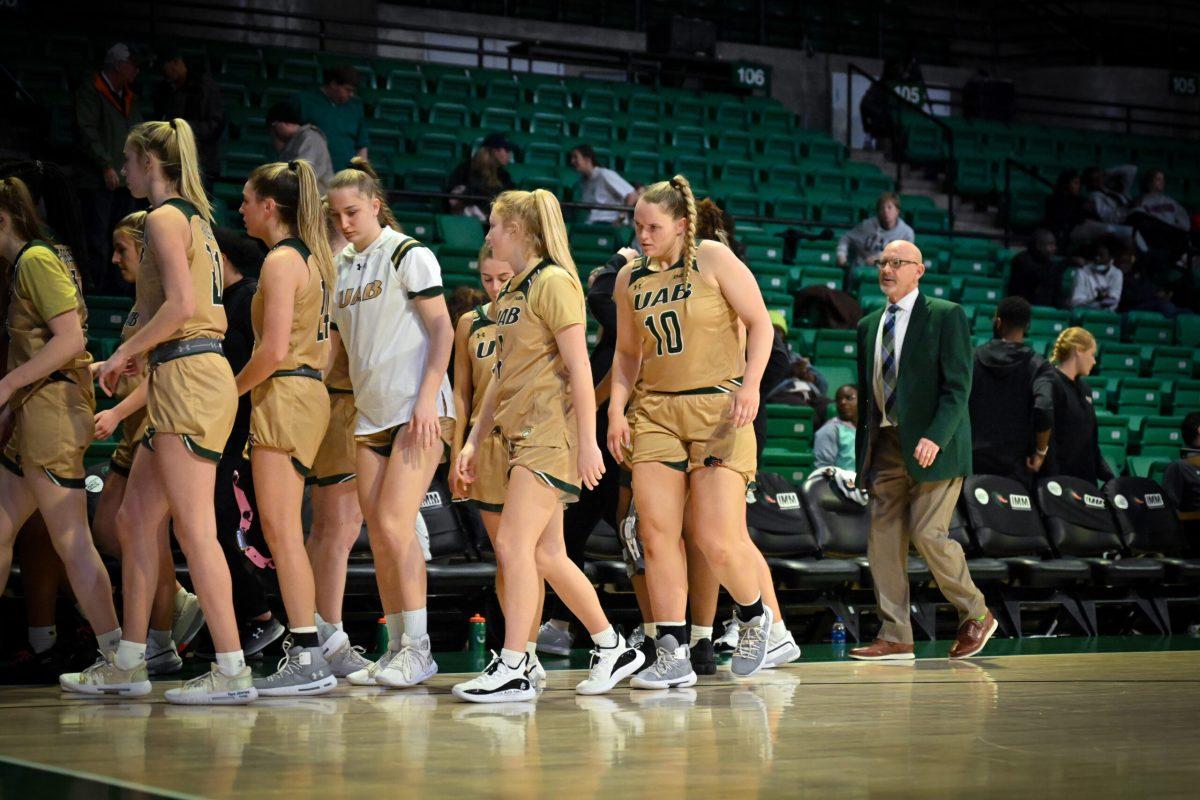The UAB women's basketball team walks off the court | Photo by Dawson Martin