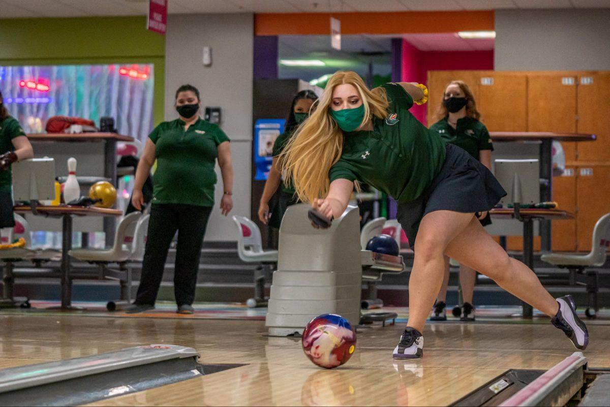 Katie Hurley bowls while masked | Photo courtesy of UAB Athletics