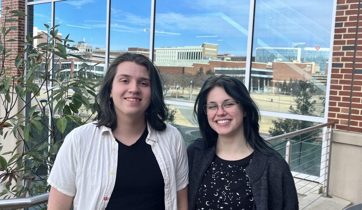 Pictured: Lawrence Schultz, left, and Em Slawson, right