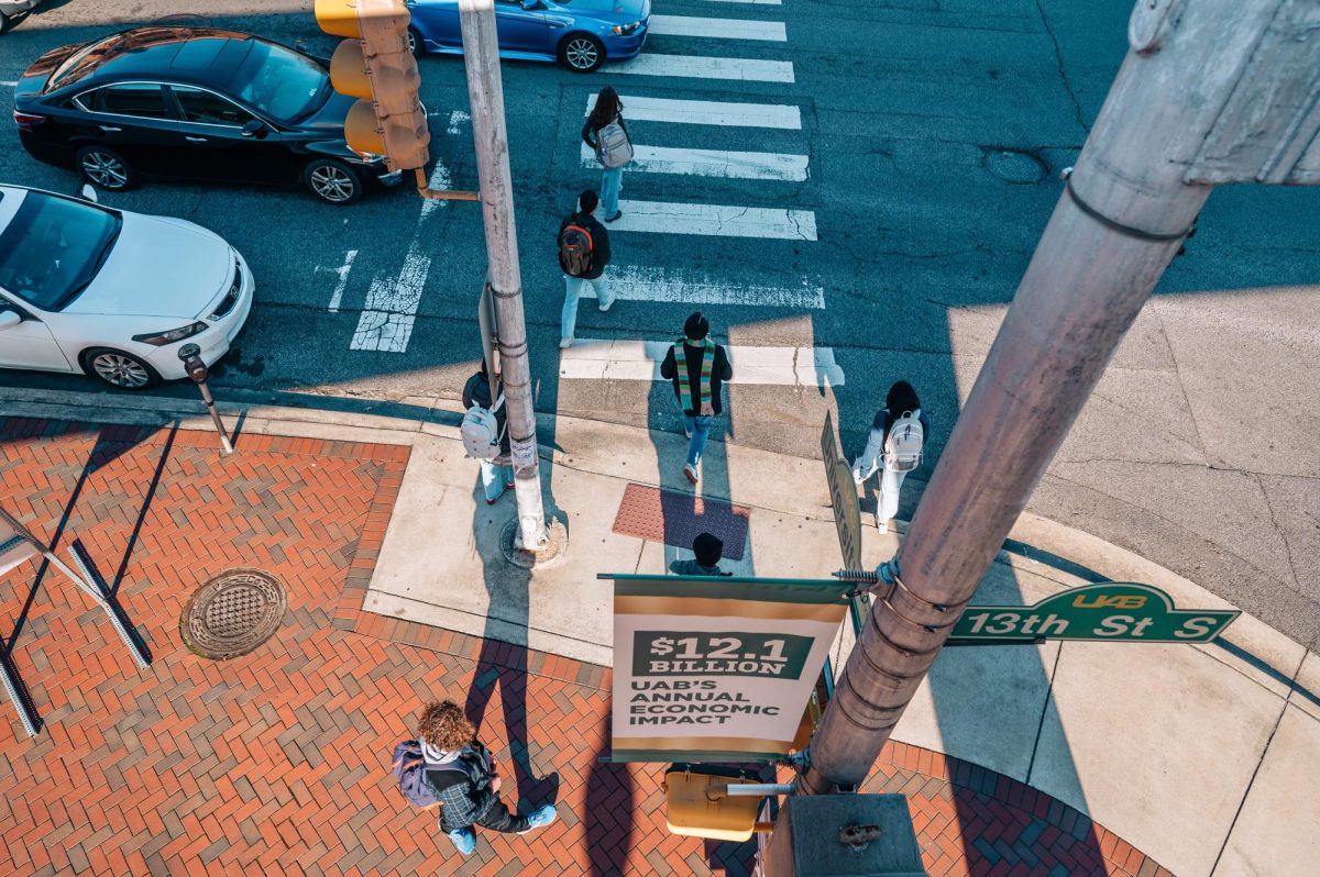 Students pictured crossing a busy street. (Photo Courtesy of UAB Digital Asset Library)